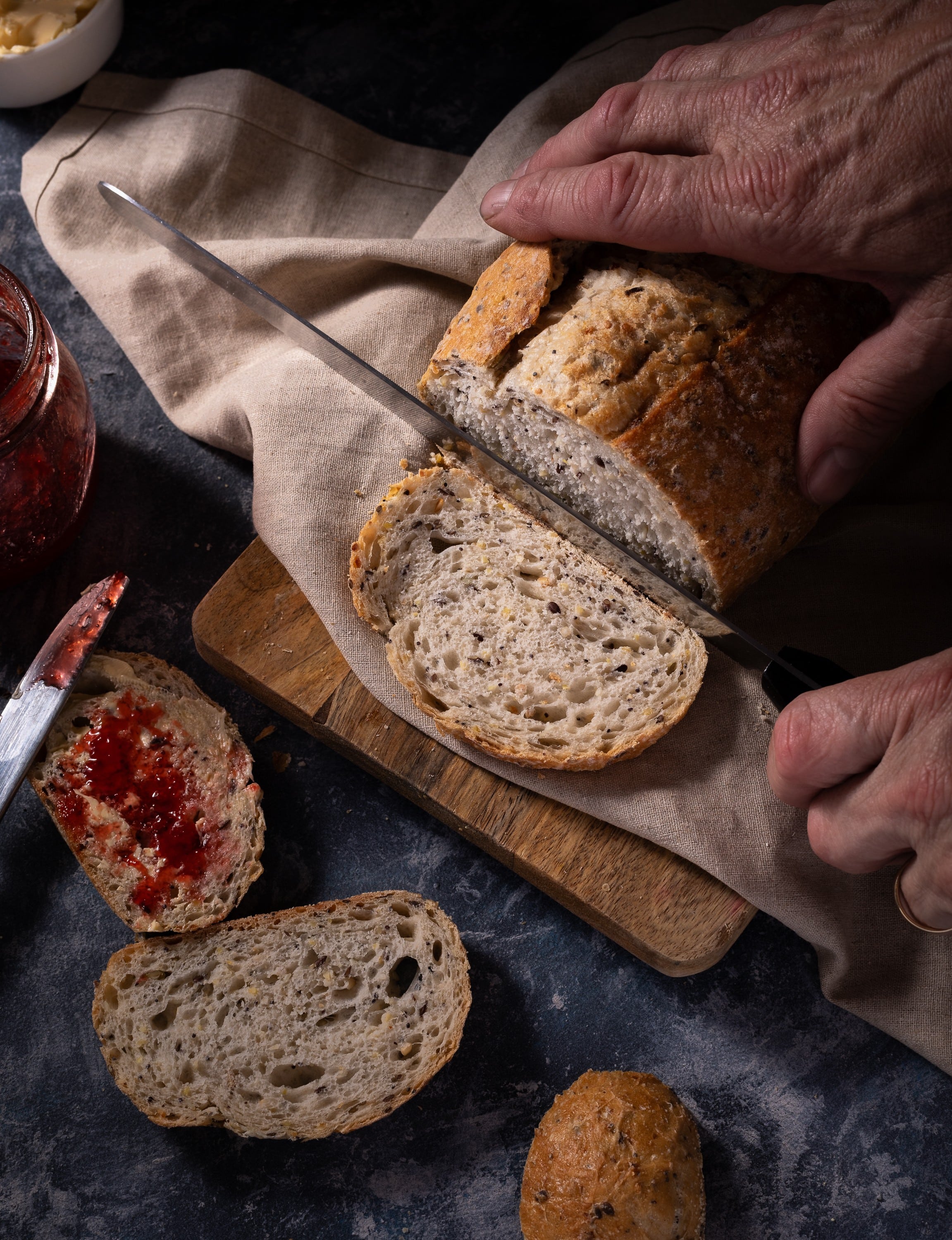 A photo of Vienna multigrain bread being sliced. Copyright Steve Wickenton