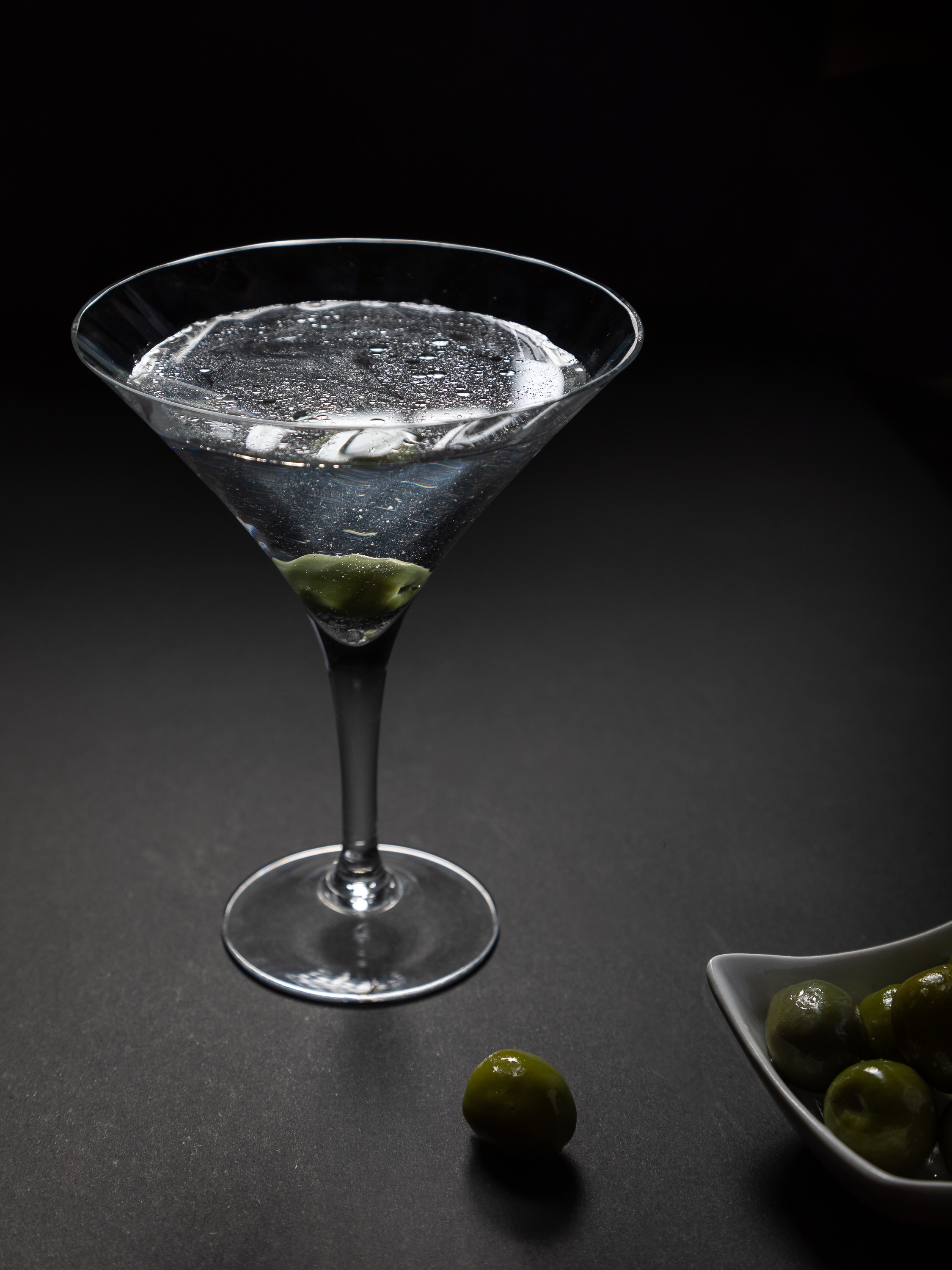 Dry Martini with green olive stirred. Bar photography Yarra Valley.